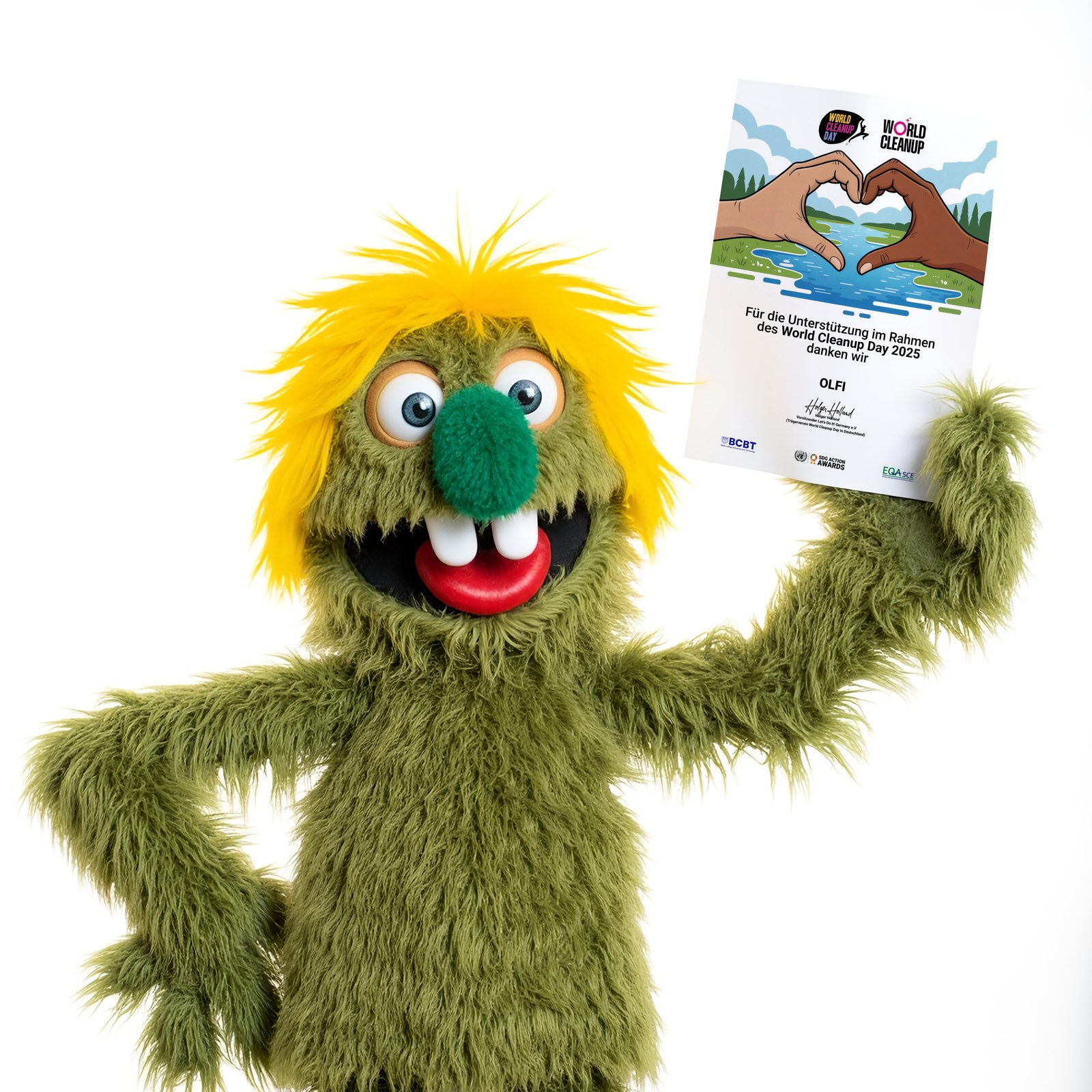 Olfi holding a World Cleanup Day 2025 certificate of thanks